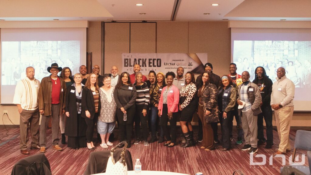 Attendees pose for a group photo at the Black Eco Chamber Mixer Event in Celebration of Black History Month.